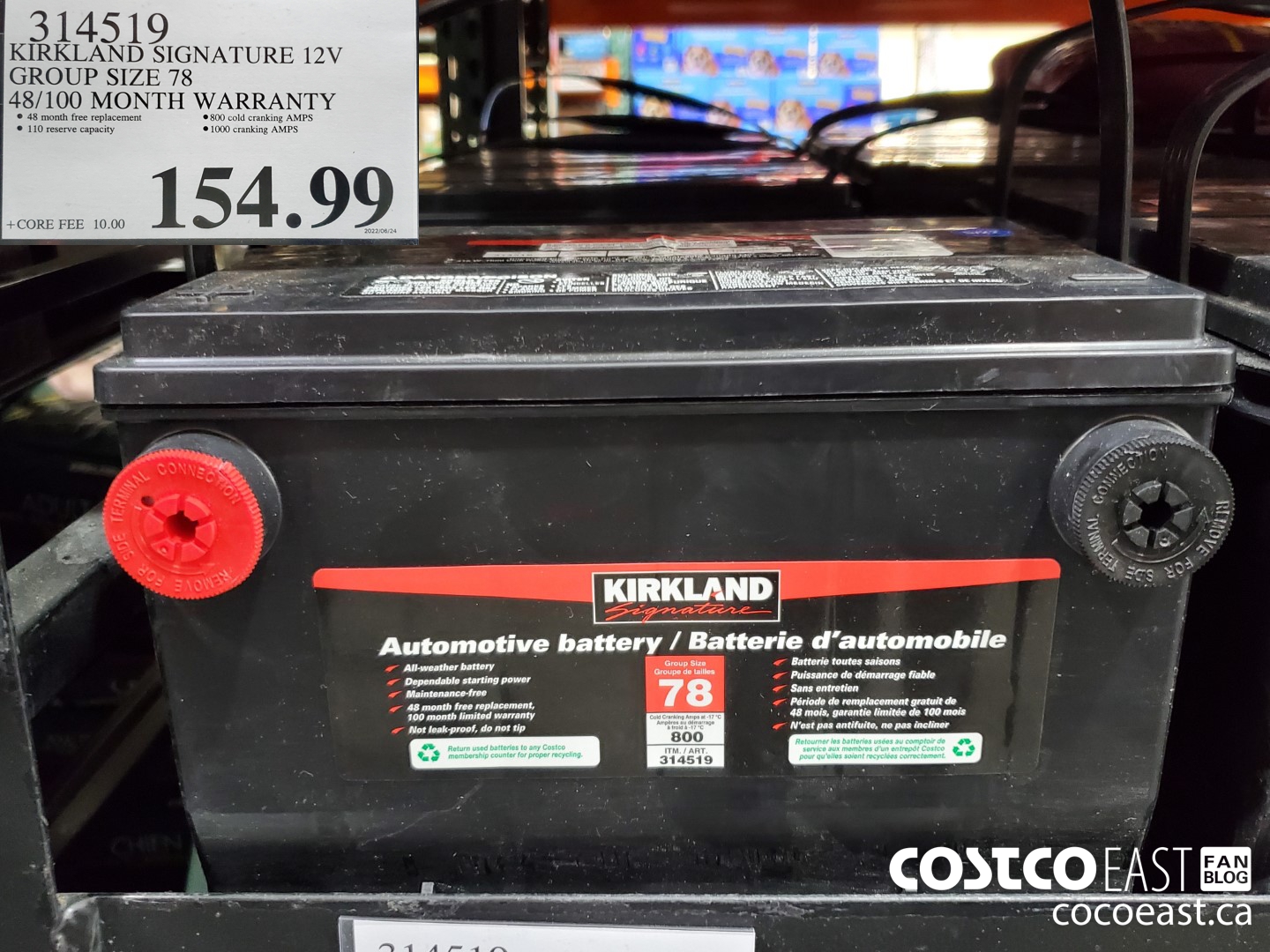 Photo of Kirkland car batteries on shelves at Costco Wholesale